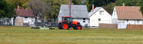 BORIS MINKEVICH / WINNIPEG FREE PRESS
A grass cutting company mows the grounds of the Kapyong Barracks Monday. Today is the first day they were allowed on the grounds and will apparently have all of the old military grounds groomed up by weeks end. Sept.12, 2016