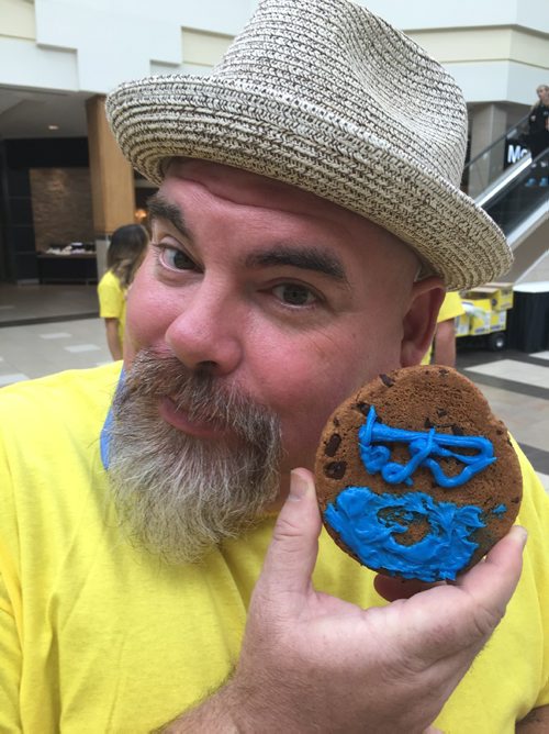DOUG SPEIRS / WINNIPEG FREE PRESS

Big Daddy Tazz holds up a cookie he decorated to look like Doug Speirs during the Smile Cookie Week cookie decorating contest at Polo Park Centre Monday. The contest is in support of the Childrens Rehab Foundation, which buys special equipment, like special bikes and iPads, for kids with long-term issues.

160912 - Monday, Sept. 12, 2016
