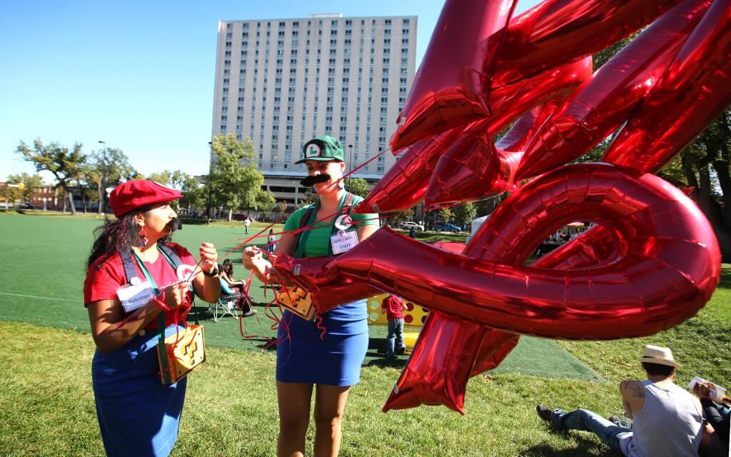 RUTH BONNEVILLE / WINNIPEG FREE PRESS

Nine Circles mascots  Mario and Luigii  prepare red ribbon balloons in shape of the Aids Symbol  for the Annual Aids walk at Central Park Saturday.

September 17, 2016
