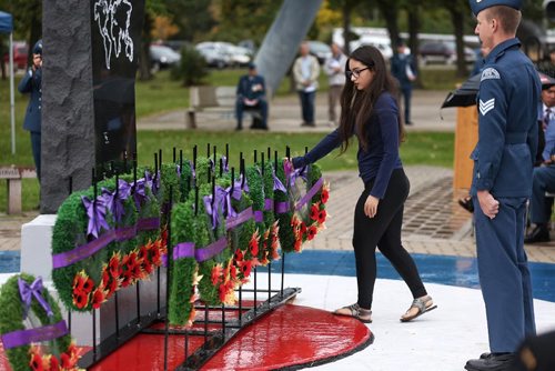 MIKE DEAL / WINNIPEG FREE PRESS

Melissa Shapiro representing the War Amps lays a wreath at the memorial in the Garden of Memories during the Battle of Britain ceremony at 17 Wing Winnipeg Sunday morning. 

160918
Sunday, September 18, 2016