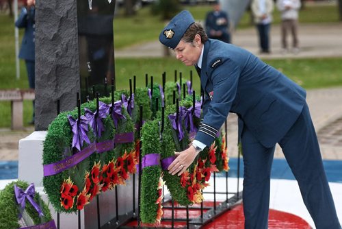 MIKE DEAL / WINNIPEG FREE PRESS

LCol Michele Claveau, CO Prairie Regional Cadet Support Unit, lays a wreath at the memorial in the Garden of Memories during the Battle of Britain ceremony at 17 Wing Winnipeg Sunday morning. 

160918
Sunday, September 18, 2016