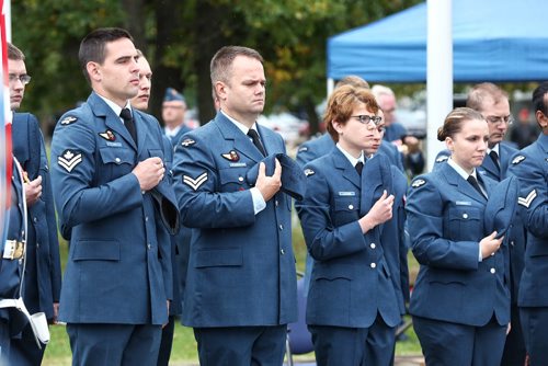MIKE DEAL / WINNIPEG FREE PRESS

Members of the Air Force honour guard remove their head gear during the Battle of Britain ceremony in the Garden of Memories at 17 Wing Winnipeg Sunday morning. 

160918
Sunday, September 18, 2016