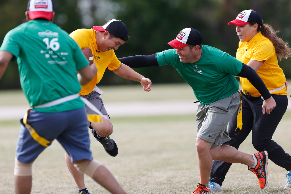 JOHN WOODS / WINNIPEG FREE PRESS
Daniel Kwan from team Go Getters dodges a tackle by Brent Stevenson of Team Happiness Is An Attitude at the 4th annual motionball Marathon of Sport to raise money for Special Olympics at John Taylor Collegiate Sunday, Sept 18, 2016.

