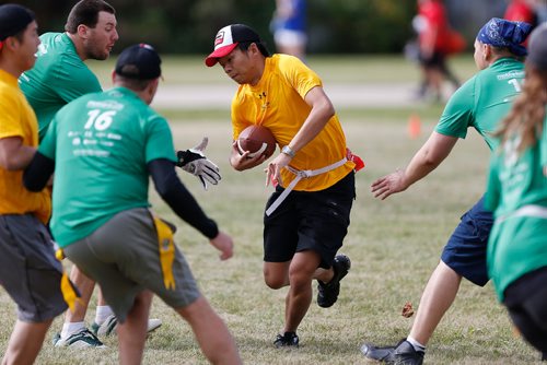 JOHN WOODS / WINNIPEG FREE PRESS
John Zhen from team Go Getters dodges a tackle by Team Happiness Is An Attitude at the 4th annual motionball Marathon of Sport to raise money for Special Olympics at John Taylor Collegiate Sunday, Sept 18, 2016.
