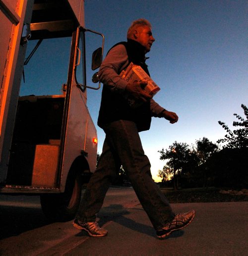 BORIS MINKEVICH / WINNIPEG FREE PRESS
49.8 INTERSECTION - Milkman Garry Peters works his route in the south part of Winnipeg super early Monday Morning. He works for Saputo Inc. (a Montreal-based Canadian dairy company). Morning comes as he keeps on delivering his milk products to customers. DAVE SANDERSON STORY. Sept. 19, 2016