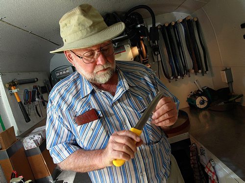 PHIL HOSSACK / WINNIPEG FREE PRESS -  Gord Hymers, tests the edge of a knife's blade in the workshop of his mobile sharpening service. After years of sharpening skateds Gord's retired and moves his tools around town to sharpen knoves and scissors. See Dave Sanderson's story. September 19, 2016