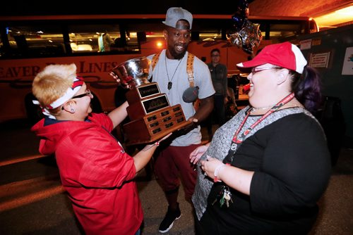JOHN WOODS / WINNIPEG FREE PRESS
Reggie Abercrombie and the Winnipeg Goldeyes are welcomed home by Josh Alen (L) and Kerri Stewart, friends and fans Tuesday, Sept 20, 2016. The team won the championship.


