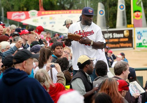 PHIL HOSSACK / WINNIPEG FREE PRESS - CHAMPIONS - Winnipeg Goldeye Reggie Abercrombie is mobbed by grateful fans at a fan appreciation evening at SHaw Park. The Goldeyes captured their third championship in franchise history on Monday with an 11-4 win over the Wichita Wingnuts in Game Five of the American Association Championship Series. See story.   September 21, 2016