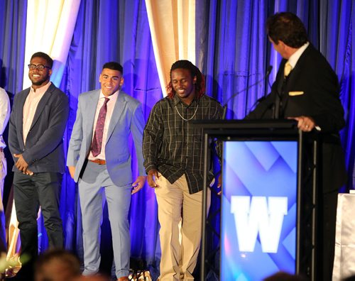 JASON HALSTEAD / WINNIPEG FREE PRESS

Host Rod Black (sports announcer for TSN and CTV) introduces Bomber running backs (from left) Pascal Lochard, Andrew Harris and Timothy Flanders at the Winnipeg Blue Bombers Legacy Gala Dinner at the RBC Convention Centre Winnipeg on Sept. 21, 2016.