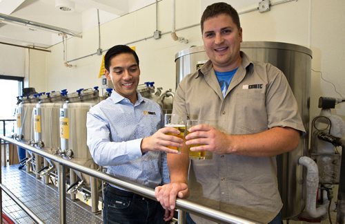 MIKE DEAL / WINNIPEG FREE PRESS
Andrew Nguyen, a Malting and Brewing Technical Specialist and Bryce Lodge, Malting and Brewing Technician, try a glass of the small portion of the beer that is kept after it is brewed for testing in the brewery of the Canadian Malting Barley Technical Centre on the main floor of the Canadian Grain Commission Building, 303 Main Street.
160922 - Thursday, September 22, 2016 - 

