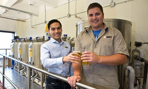 MIKE DEAL / WINNIPEG FREE PRESS
Andrew Nguyen, a Malting and Brewing Technical Specialist and Bryce Lodge, Malting and Brewing Technician, try a glass of the small portion of the beer that is kept after it is brewed for testing in the brewery of the Canadian Malting Barley Technical Centre on the main floor of the Canadian Grain Commission Building, 303 Main Street.
160922 - Thursday, September 22, 2016 - 

