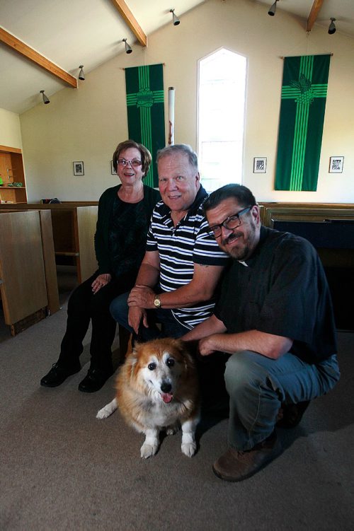 PHIL HOSSACK / WINNIPEG FREE PRESS -  Left to right Valerie and Ray Christianson pose with their dog Keelie and Rev Wayne McIntosh  at St Francis Anglican Church Thursday. See Brenda Suderman story re: Blessing of the animals on St Francis Day. September 22, 2016
