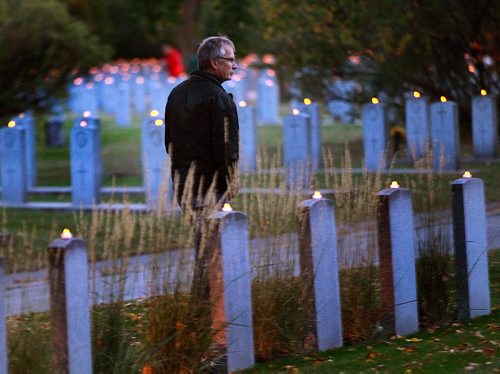 PHIL HOSSACK / WINNIPEG FREE PRESS -  Mike Atkinson strolls through Brookside Cenetery's Field of Honor Thursday evening.  LED candles on top of one of over 11,000 military graves lit up Canada's 2nd largest Military cenetery Thursday evening preparing for the anniual Candlelight Service of Rememberance. See Release below. September 22, 2016

Public invited to Candlelight Service of Remembrance



Event to recognize, honour those who have served



Winnipeg, MB  Members of the public are invited to attend a Candlelight Service of Remembrance today, Thursday, September 22 at 8 p.m. at the Field of Honour in Brookside Cemetery, 3001 Notre Dame Avenue to recognize and honour those who have served.



A candle will be placed on each of the more than 11,000 military monuments found in Brookside Cemetery, one of the oldest and largest military interment sites in Canada.



Thousands of Canadian men and women have served and given their lives during war to help bring about peace, and they deserve our remembrance and thanks, said Jon Reyes, Member of the Manitoba Legislative Assembly for St. Norbert and Special Envoy for Military Affairs in Manitoba. We continue to honour and commemorate their service, as well as the sacrifices made by the families they left behind.



This service is about giving thanks, and honouring a past that has shaped us as a city, a province, and a nation, said Mayor Brian Bowman. It is also a chance to remember and recognize the tremendous sacrifices made to make our country and our city safe.



In addition to all three levels of government, Lieutenant Governor Janice Filmon and military representatives will take part in the service.



For more information, visit: Candlelight Service of Remembrance
