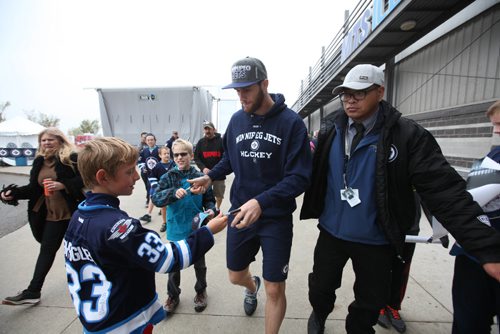RUTH BONNEVILLE / WINNIPEG FREE PRESS

Jets player, Quinton Howden, sigms autographs as he makes his way into the IcePlex arena to play hockey with his teammates at Jets FanFest  Saturday. 

September 24, 2016