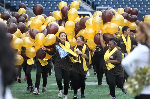 RUTH BONNEVILLE / WINNIPEG FREE PRESS

Hundreds of University of Manitoba students ran onto Investors Group Field with balloons in celebration of Front and Centre capital campaign raising more than $400M Saturday during the Bisons half-time game.  
September 24, 2016

