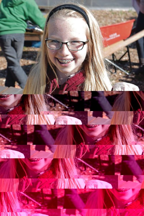 Canstar Community News East Selkirk Middle School student Julia holds a tomato she harvested at Winnipeg Harvests garden on Sept. 14, 2016. (Ligia Braidotti/Canstar Community News)