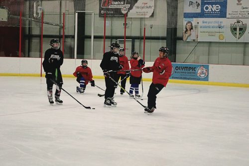 Canstar Community News Coack Rick Farmer teaches all hockey skill levels at the Seven Oaks School Division Hockey Skills Academy.