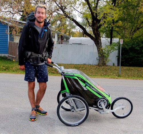 BORIS MINKEVICH / WINNIPEG FREE PRESS
Photo of 27 year old Winnipeg born cross-Canada runner Dylan Gray with the equipment he runs with. He's raising awareness and money for the Against Malaria Foundation. Photo taken in Charleswood. Gordon Sinclair column. Sept. 27, 2016