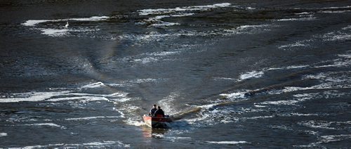 PHIL HOSSACK / WINNIPEG FREE PRESS - FISHERS - A boat runs past a pelican manovering for position  on the Red River near the Lockport Dam and locks.   September 20, 2016