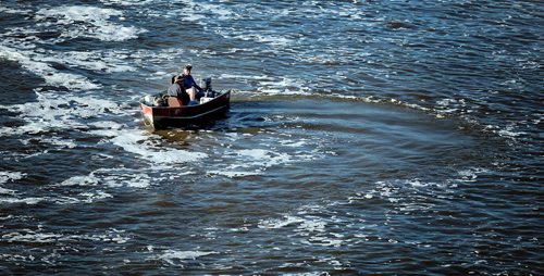 PHIL HOSSACK / WINNIPEG FREE PRESS - FISHERS -  Anglers manouvre their boat on the Red River near the Lockport Dam and locks.   September 20, 2016
