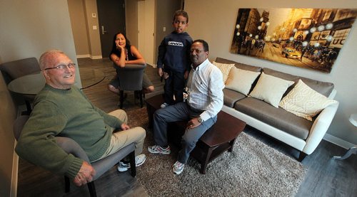 PHIL HOSSACK / WINNIPEG FREE PRESS -  Left to RIght, Eldon Toews, Angela Lavallee, 5 yr old Ewun and his father Airia Kidane are a few of the diverse tenants of the Downtown Commons a new apartment complex at Colony and Portage ave.  See Carol Sanders' story.  September 28, 2016