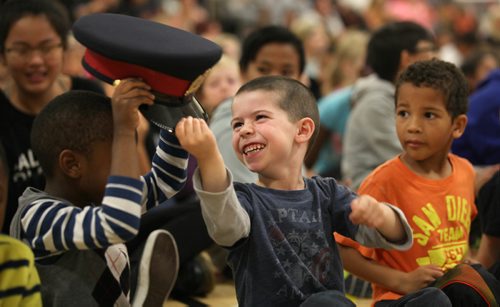 RUTH BONNEVILLE / WINNIPEG FREE PRESS

Salisbury Morse Place School kindergarden student Alex Auringer smiles as he passes Sargent Johansson's hat around to his classmates to try on as Winnipeg Police Service visit school to receive a time capsule from students to be placed in the in the new police Thursday. 
Headquarters building, and sealed for fifty years.  The Winnipeg Police Service is carrying on a tradition that started with the former police headquarters when it was built 50 years ago.  
Standup photo (Could  go with group shot of students handing over time capsule to acting chief).   

September 29, 2016

