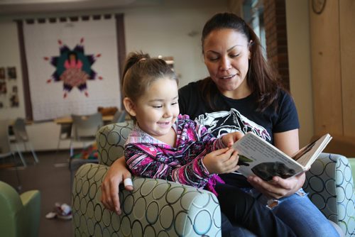 RUTH BONNEVILLE / WINNIPEG FREE PRESS

Three-year-old Sienna Wesley lights-up with a bright smile as she reads a children's book on animals with her mom, Stephanie Wesley, in the new Mothering Project Clinic, part of Mount Carmel Clinic, on Thursday.  

September 29, 2016

