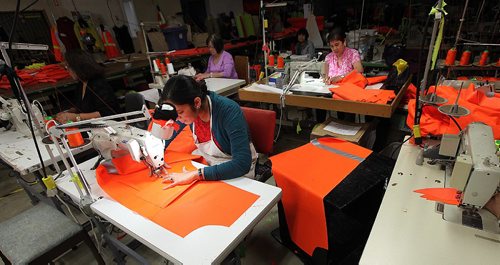 PHIL HOSSACK / WINNIPEG FREE PRESS -  Harpreet Kaur bends to her trade at The Stitch Factory the local sewing room takes local designs and orders and produces the clothing. See Connie's story. . September 28, 2016