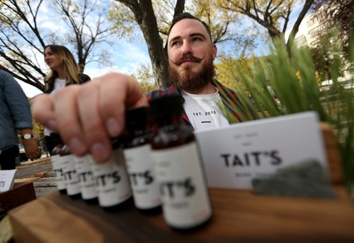 TREVOR HAGAN / WINNIPEG FREE PRESS
Travis Tait selling his Tait's Beard Tonic at the Lucky Girl Pop Up in Old Market Square, Saturday, October 1, 2016.