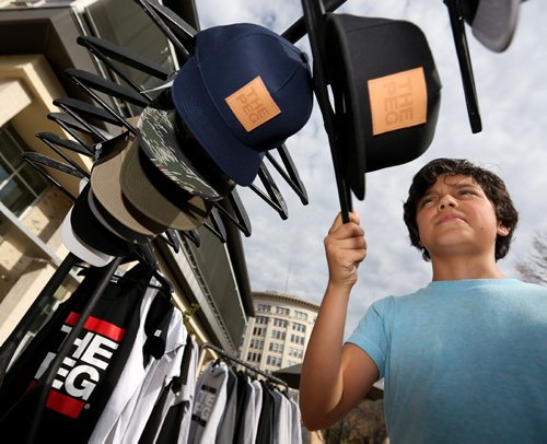 TREVOR HAGAN / WINNIPEG FREE PRESS
Keenan Lehmann, 12, looks at The Peg Authentic hats while shopping for his sister at the Lucky Girl Pop Up in Old Market Square, Saturday, October 1, 2016.