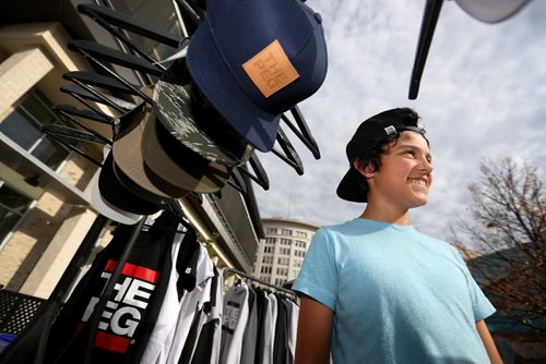 TREVOR HAGAN / WINNIPEG FREE PRESS
Keenan Lehmann, 12, tries on a The Peg Authentic hat while shopping for his sister at the Lucky Girl Pop Up in Old Market Square, Saturday, October 1, 2016.