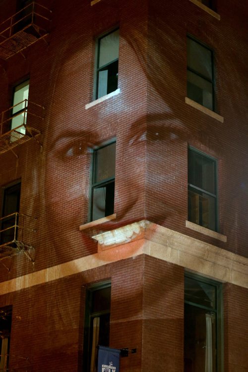 TREVOR HAGAN / WINNIPEG FREE PRESSPhotographer Leif Norman projects portraits onto the side of the Crocus Building, as part of Nuit Blanche, Saturday, October 1, 2016.