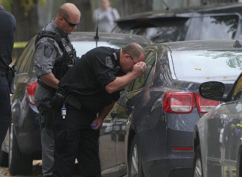 JOE BRYKSA / WINNIPEG FREE PRESS Winnipeg Police and emergency crews are on the scene of College Ave where they have located two bodies in a car parked on the street- Two neighbors verified the discovery. Oct 03, 2016 -(See Carol Sanders story)