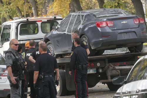 JOE BRYKSA / WINNIPEG FREE PRESS Winnipeg Police and emergency crews are on the scene of College Ave where they have located two bodies in a car parked on the street- Two neighbors verified the discovery. The car was towed from the street to a undisclosed location to remove the bodies.Oct 03, 2016 -(See Carol Sanders story)