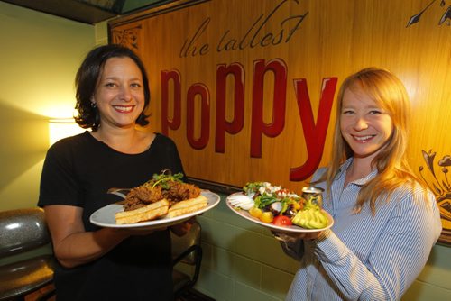 BORIS MINKEVICH / WINNIPEG FREE PRESS
FOOD - Venues on Sherbrook Street. 103 Sherbrook is where the The Tallest Poppy is. Owner Talia Syrie with the Chicken and Waffles, with Manager Eileen Fowler holding the Cobb salad. Oct. 3, 2016