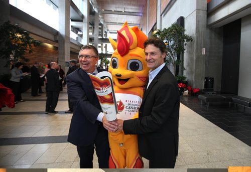RUTH BONNEVILLE / WINNIPEG FREE PRESS

Jeff Hnatiuk, President & CEO, 2017 Canada Summer Games (right) and 
Kelvin Shepherd, Manitoba Hydro President & CEO, unveil the Canada Summer Games torch Wednesday at the Manitoba Hydro Building that will be carried through the Torch Relay during games in Winnipeg next summer.  

October 05, 2016

