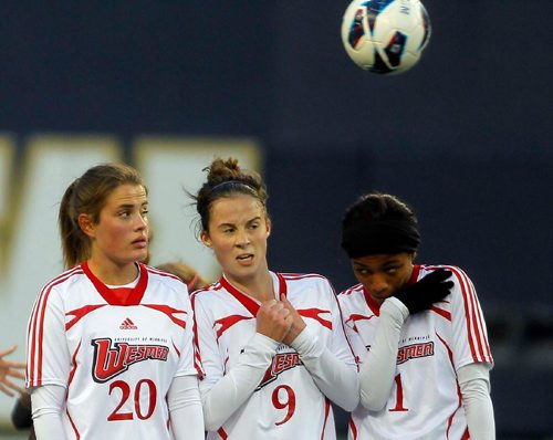BORIS MINKEVICH / WINNIPEG FREE PRESS
University of Manitoba Bison women's soccer play the second ever CIS game at Investors Group Field versus University of Winnipeg Wesmen. Wesman wall L-R #20 Maeghan Lindsay, #9 Danielle Comeau, and #1Jamila Calvez. Oct. 6, 2016