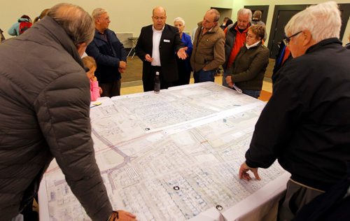 BORIS MINKEVICH / WINNIPEG FREE PRESS
Dillon Consulting Ltd. public engagement lead Dave Marsh (wearing black suit top with name tag on it, glasses, middle) answers questions on the Waverley Underpass project. Winnipeggers attended a public open house about the Waverley Underpass project at the Caboto Centre, 1055 Wilkes Avenue. The open house was a opportunity for the public to view the detailed design for the underpass, learn about pedestrian and cycling infrastructure, intersection and road improvements, as well as construction timelines and detours. There was two sessions 3:30 p.m. to 5:30 p.m. and 7:00 p.m. to 9:00 p.m. These photos were shot in the 7-9pm session. Oct. 6, 2016