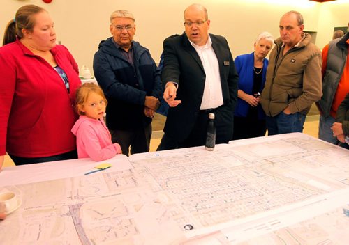 BORIS MINKEVICH / WINNIPEG FREE PRESS
Dillon Consulting Ltd. public engagement lead Dave Marsh (wearing black suit top with name tag on it, glasses, pointing at map, 4th from the left) answers questions on the Waverley Underpass project. Winnipeggers attended a public open house about the Waverley Underpass project at the Caboto Centre, 1055 Wilkes Avenue. The open house was a opportunity for the public to view the detailed design for the underpass, learn about pedestrian and cycling infrastructure, intersection and road improvements, as well as construction timelines and detours. There was two sessions 3:30 p.m. to 5:30 p.m. and 7:00 p.m. to 9:00 p.m. These photos were shot in the 7-9pm session. Oct. 6, 2016