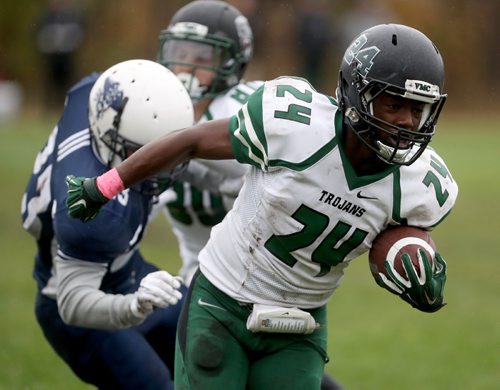 TREVOR HAGAN / WINNIPEG FREE PRESS
Vincent Massey Trojans, Geleta Gurmu (24) carries the ball, while playing against the Grant Park Pirates, Friday, October 7, 2016.