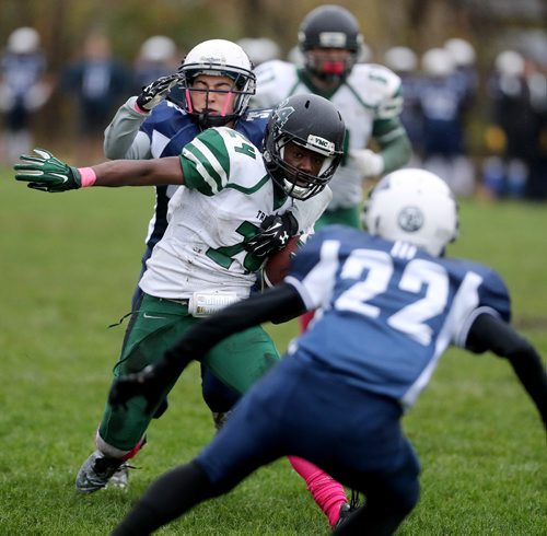 TREVOR HAGAN / WINNIPEG FREE PRESS
Vincent Massey Trojans, Geleta Gurmu (24) is tackled by Grant Park Pirates Roey Efron (32), Friday, October 7, 2016.