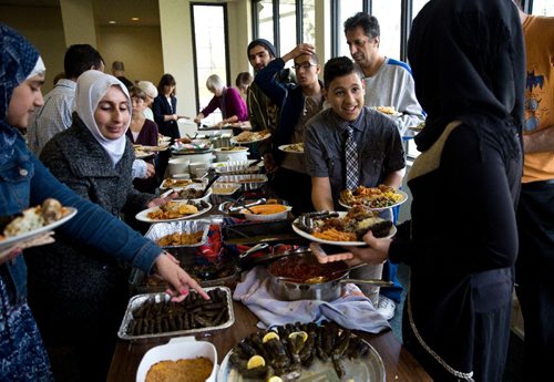 MIKE DEAL / WINNIPEG FREE PRESS
A potluck supper hosted by Refuge Winnipeg for the three Syrian refugee families who arrived here last October and all the people who privately sponsored them Monday afternoon at the First Unitarian Universalist Church of Winnipeg.
161010 - Monday, October 10, 2016 - 

