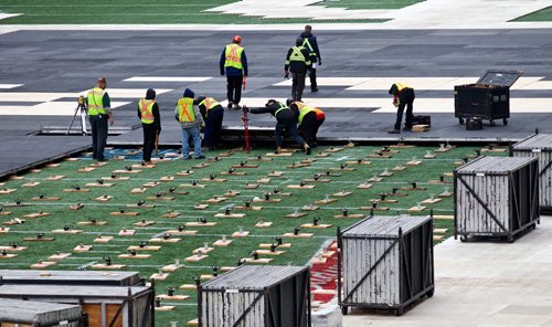 MIKE DEAL / WINNIPEG FREE PRESS
Crews start to install the flooring in Investors Group Field for the upcoming NHL Heritage Classic which takes place Sunday, October 23, 2016.
161011 - Tuesday, October 11, 2016 - 

