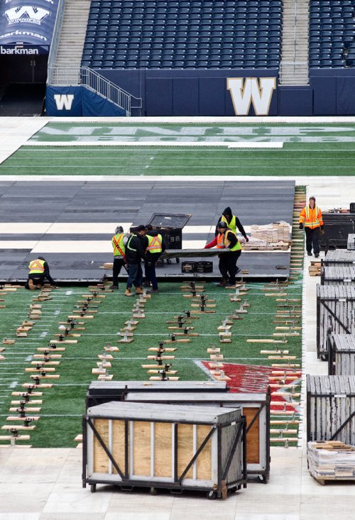 MIKE DEAL / WINNIPEG FREE PRESS
Crews start to install the flooring in Investors Group Field for the upcoming NHL Heritage Classic which takes place Sunday, October 23, 2016.
161011 - Tuesday, October 11, 2016 - 

