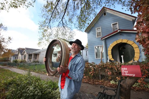 RUTH BONNEVILLE / WINNIPEG FREE PRESS

49.8 Intersection Feature:
Victor Street Home owner, Hardy Groening, shows off his so-called Hobbit House.  His two-story  home is something to behold with its big round door,  round gate and window that he is about to install.  His home also features a indoor climbing wall (he has climbing ropes for safety, not in photo) and hobbit sized doorway off one of the upstairs bedrooms leading to a second-storey deck that looks like a boat.  
See Dave Sanderson story.  
October 08, 2016
