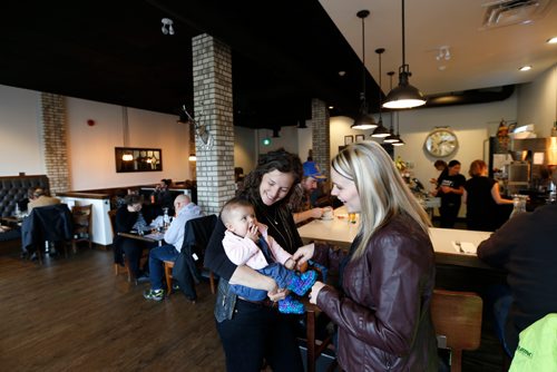 WAYNE GLOWACKI / WINNIPEG FREE PRESS


Sunday. THIS CITY - Marion Street Eatery. Co-owners Laneil Smith holds her 4 month old daughter Lennon and  Melissa Hryb at right.Oct. 12 2016