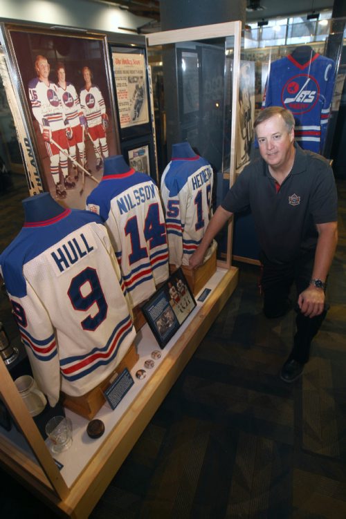JOE BRYKSA / WINNIPEG FREE PRESSRick Browlee- Executive Director of the Manitoba Sports Hall of Fame kneels in front of the Hot Line exhibit- 1 of 16 cases in the 60 Years of Pro Hockey exhibit that will be on display until Apr 2017-    -Oct 13, 2016 -(See Scotts story)
