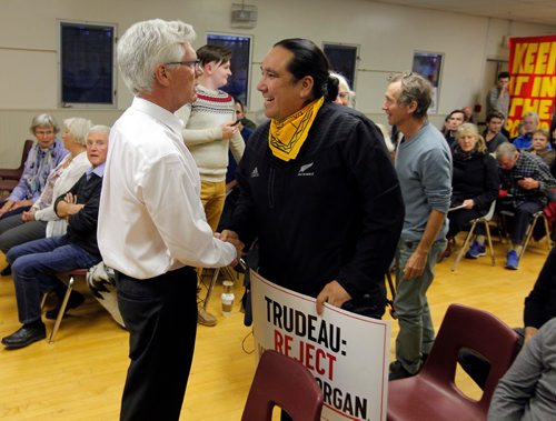 BORIS MINKEVICH / WINNIPEG FREE PRESS
Natural Resource Minister Jim Carr holds a town hall at Fort Garry Community Centre in Winnipeg. Minutes before the town hall started Carr, left, shakes hands with activist Clayton Thomas-Muller, left,  of the Mathais Colomb Cree Nation in Northern Manitoba. Oct. 13, 2016