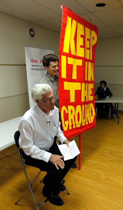 BORIS MINKEVICH / WINNIPEG FREE PRESS
Natural Resource Minister Jim Carr holds a town hall at Fort Garry Community Centre in Winnipeg. Carr, sitting in white shirt-left, allowed protestors to set up right on stage. Oct. 13, 2016