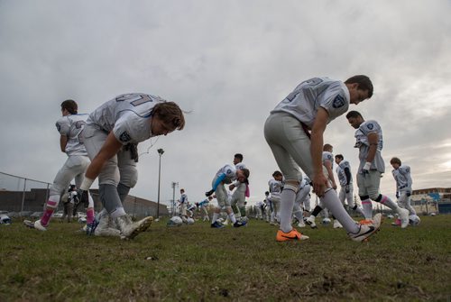 DAVID LIPNOWSKI / WINNIPEG FREE PRESS

Oak Park Raiders warm up at Charlie Krupp Stadium before playing the Sisler Spartans Friday October 14, 2016, less than a week after their equipment storage unit went up in flames.